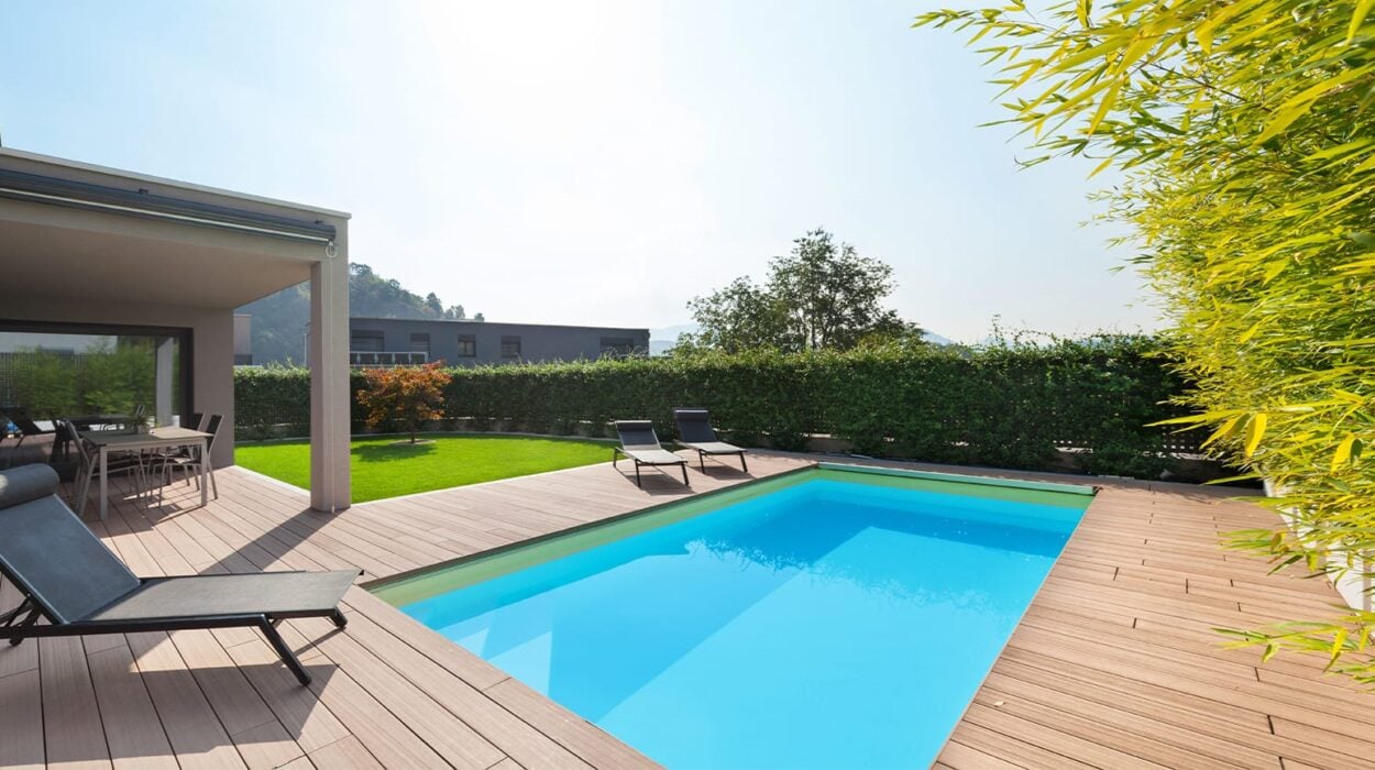 fibreglass pool in backyard with wooden decking