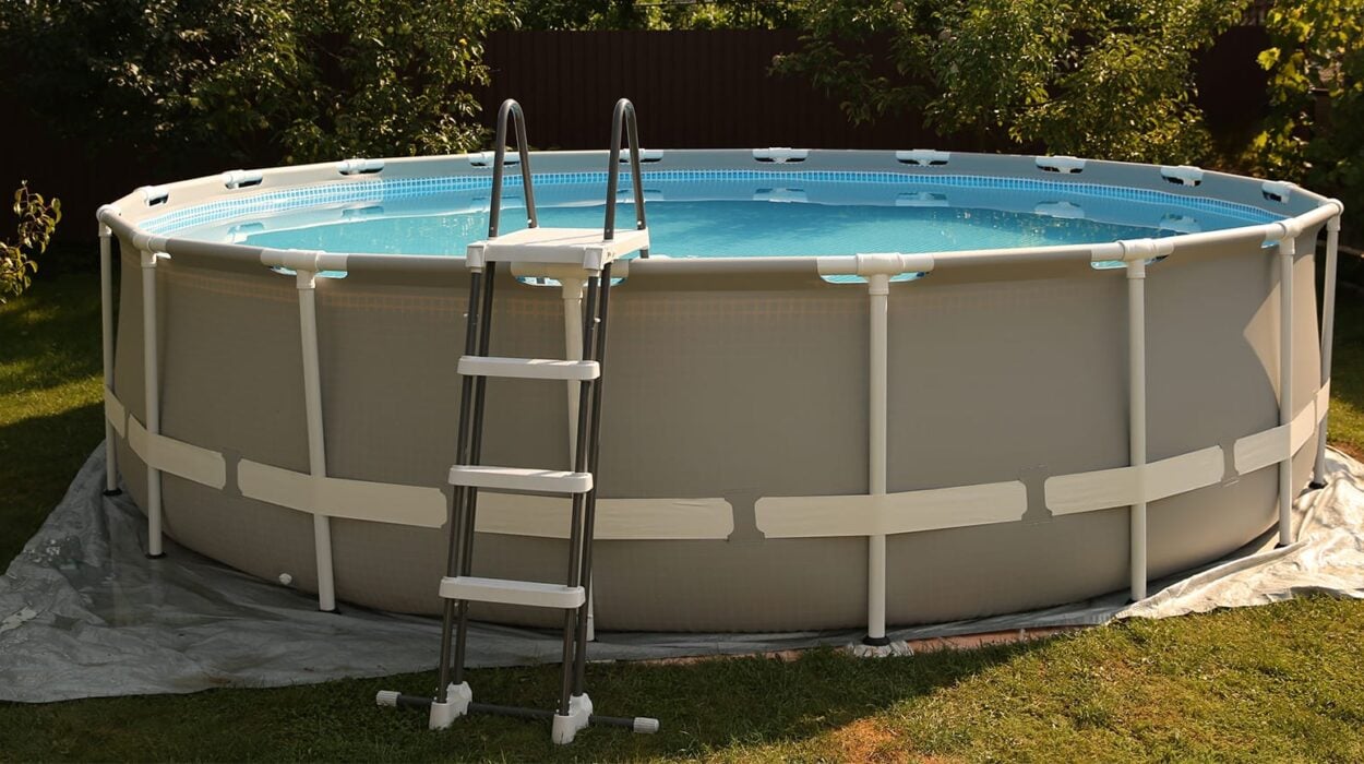 Above ground swimming pool outdoors on sunny day