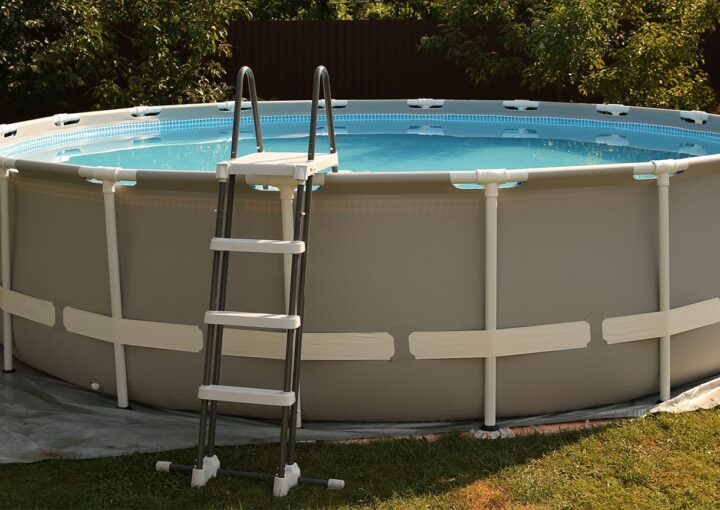 Above ground swimming pool outdoors on sunny day