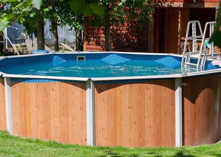 above ground swimming pool in backyard