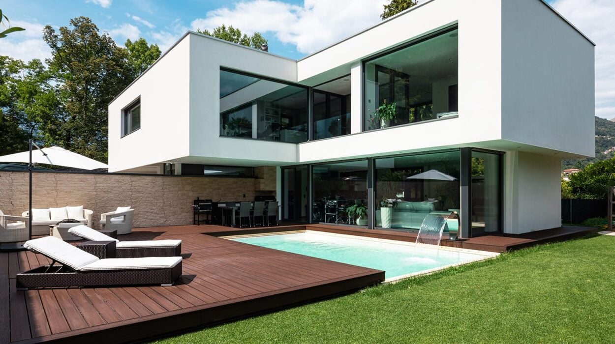 luxury wooden deck around pool in home backyard