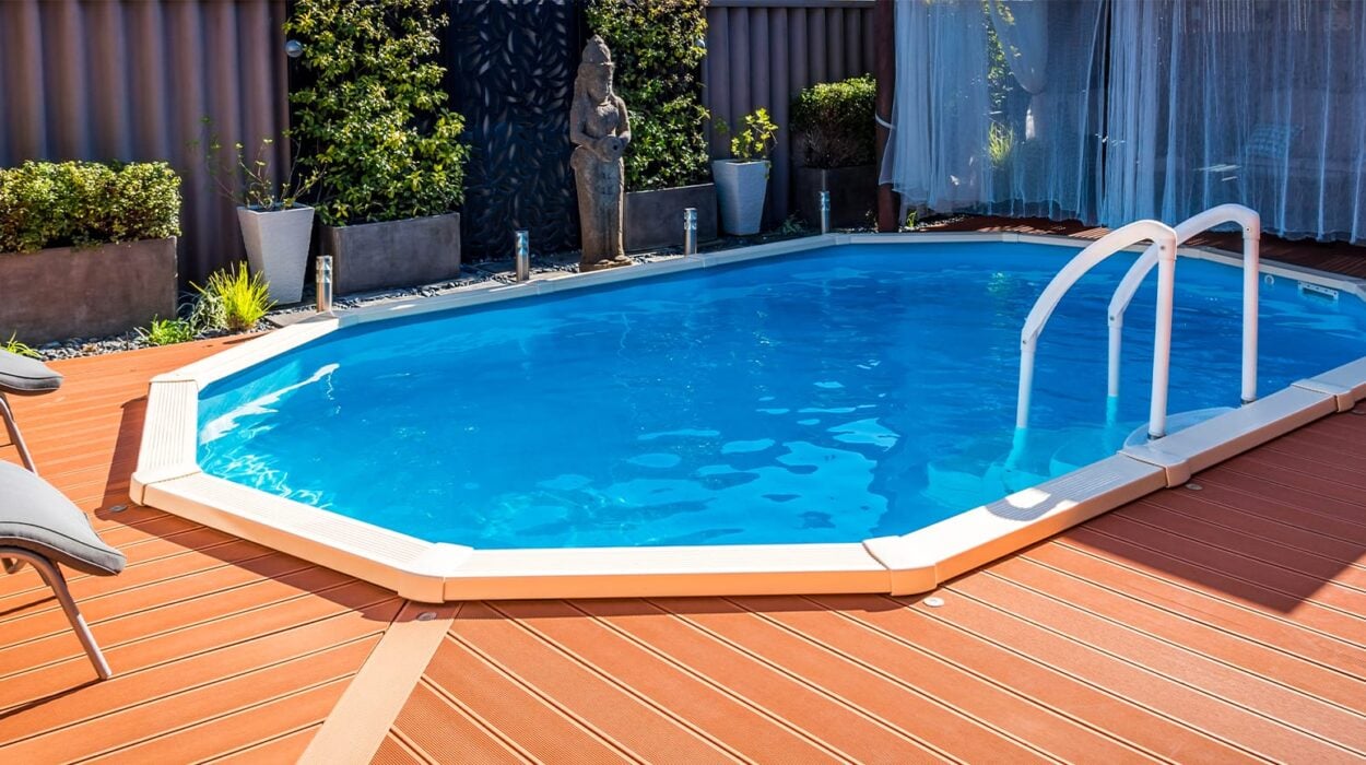 above ground pool sunken below ground and surrounded by decking