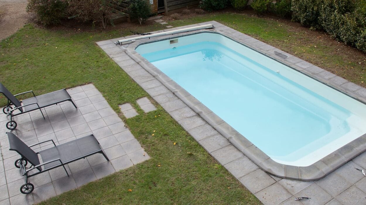 pool concrete deck with landscape and sitting space