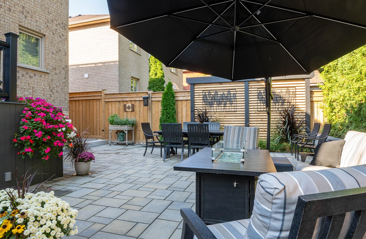 beautiful backyard, sitting setup, flowers decor, privacy screen, fence, interlocking floor