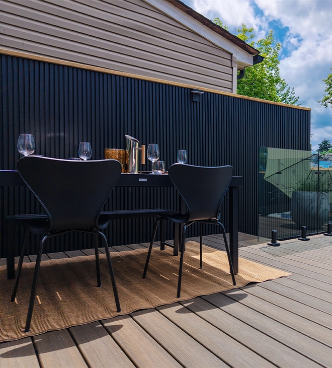 chairs and table with fence on backyard
