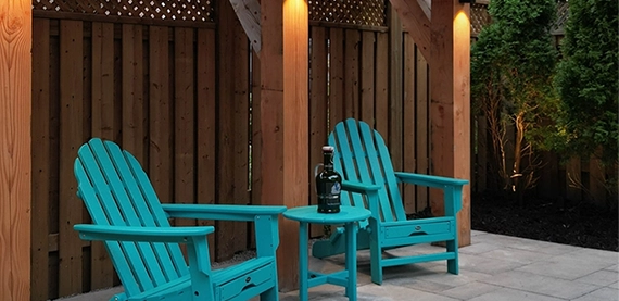 challenging outdoor spaces seating chairs near wooden fence in outdoor space