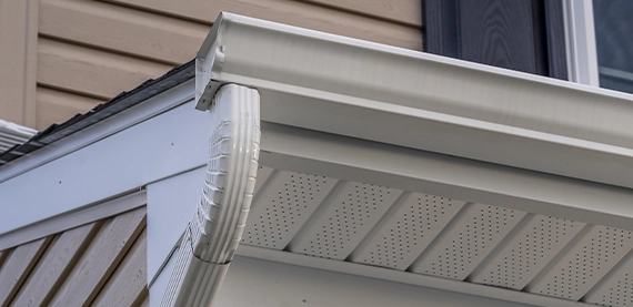 close view of roof eavestrough, soffit and fascia
