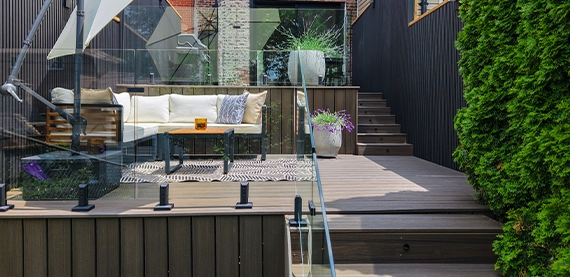 close view of wooden deck and glass rails