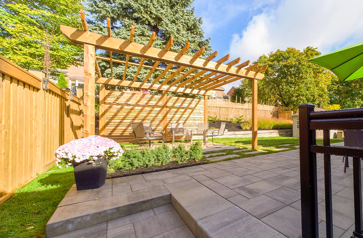 custom carpentry gazebo with interlocking patio in home backyard