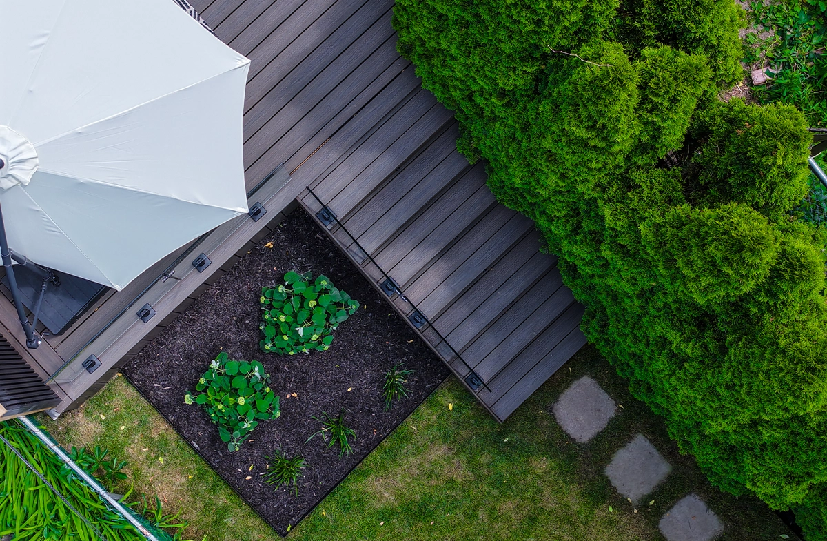 landscaping on ground and steps to deck