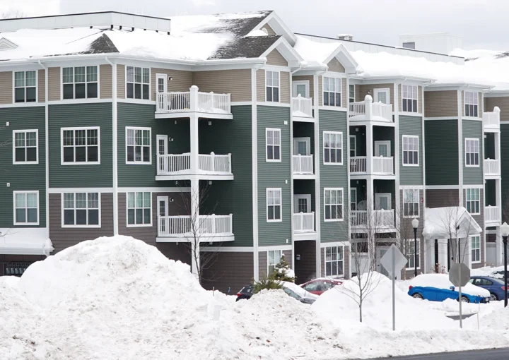 modern apartment building after winter snow storm