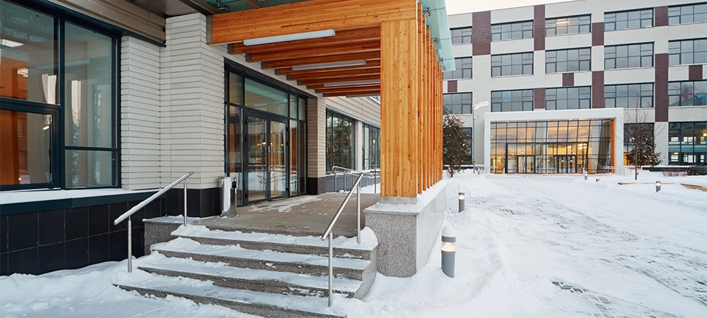 One of entrances to business center covered with snow
