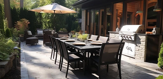 open kitchen in home backyard, sitting gathering setup and landscaping