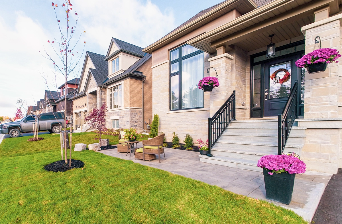 sodding, planting and interlocking walk way in front of home