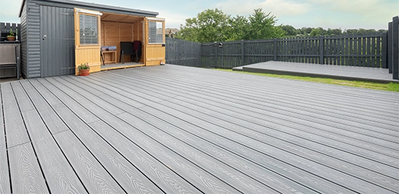 trex deck in home backyard space and fencing wall