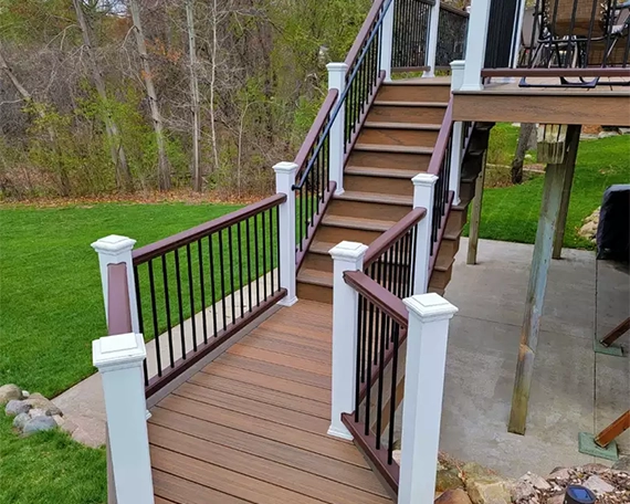 wooden stairs and railing and deck