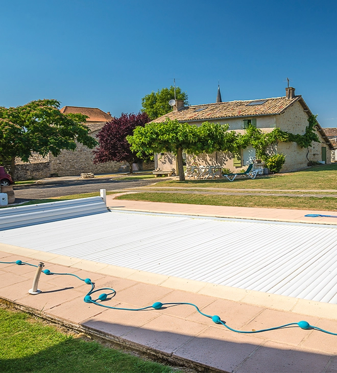 energy efficient automatic pool cover automatic pool cover covered full swimming pool in home backyard, protect from sun light