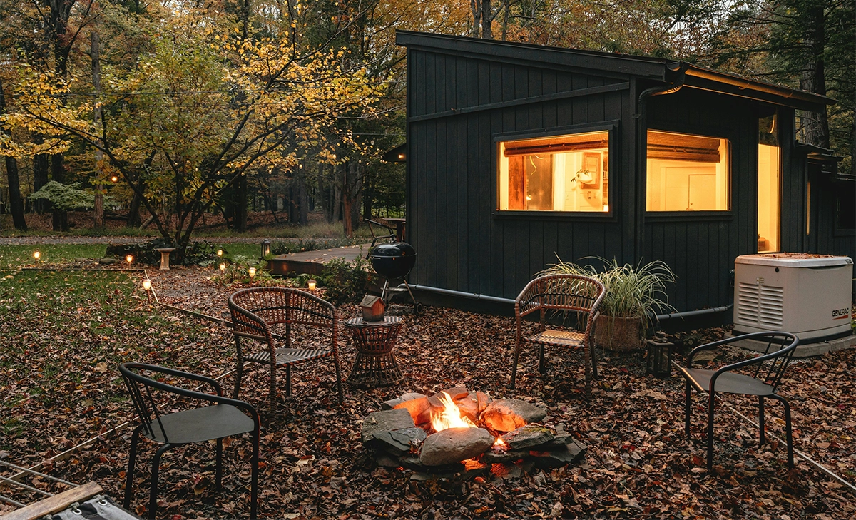 accessory structure in forest custom room in forest, chairs around firepit, concept of accessory structure