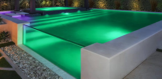 lighting feature in acrylic and glass walled pool, covered with concrete wall