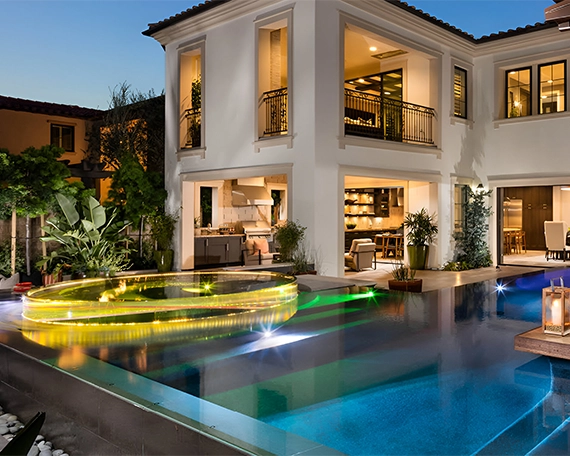 luxury home front view, acrylic and glass walled pool with lighting feature