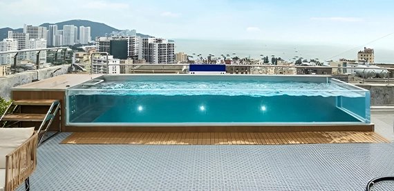 acrylic and glass walled pool on building roof top