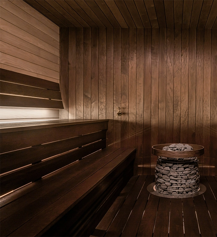 outdoor sauna inside view, lighting behind sitting bench