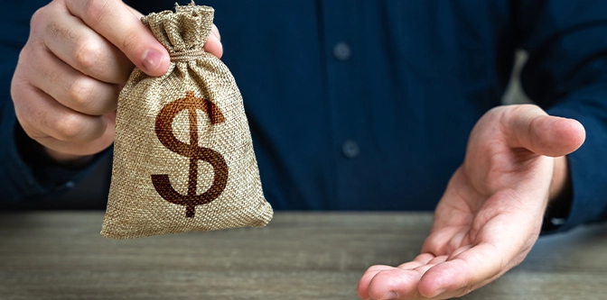 The man offers a deal in return. Giving gesture and dollar money bag. Banking and crediting. Mortgage, loan approval. Salary benefits. Attracting investments. Deposit savings. Cashback.