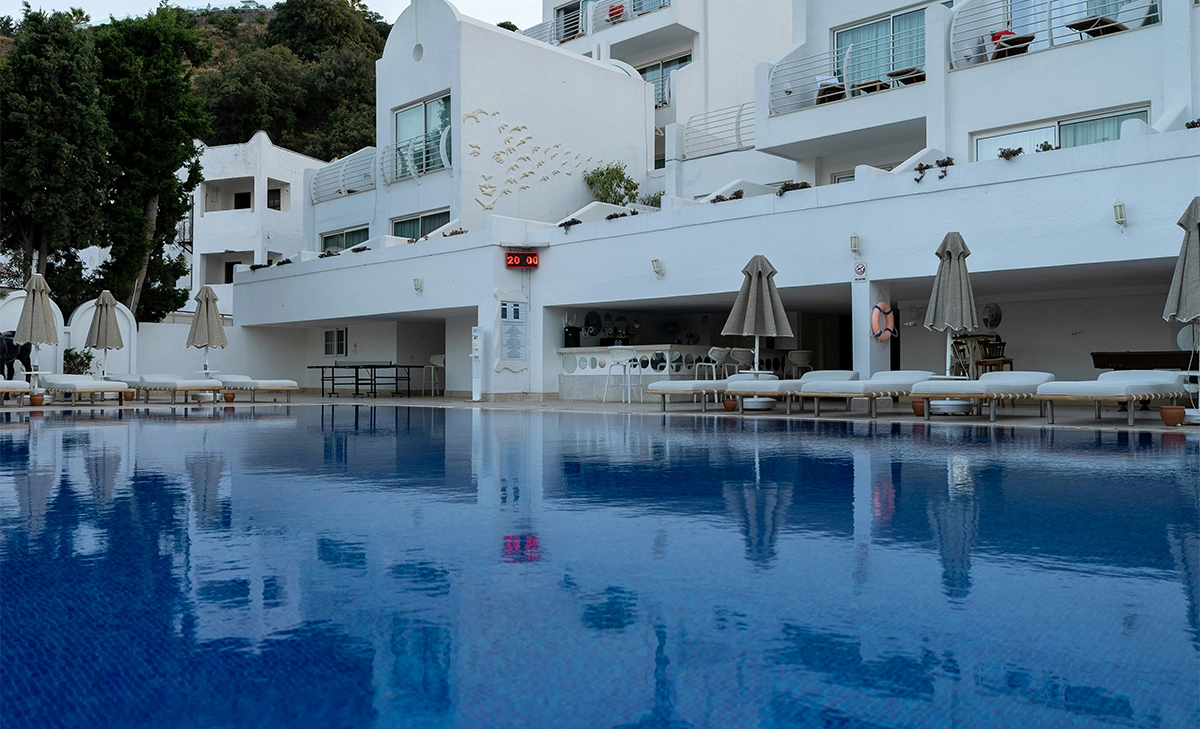 commercial swimming pool in front of building commercial swimming pool in front of hotel building