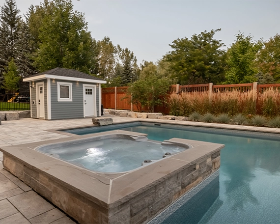 concrete pool image one concrete pool with waterfall in home backyard, custom carpentry, interlock deck and fence