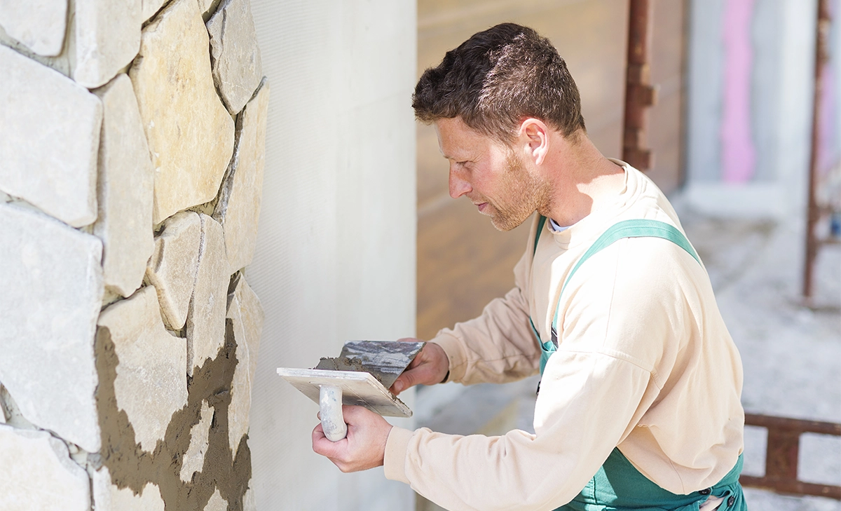craftsman installing natural stone wall expert craftsman installing natural stone wall