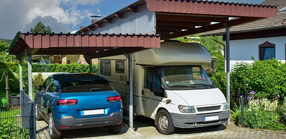 custom carport for two vehicles Carport of varnished wood in Front of a residential Building