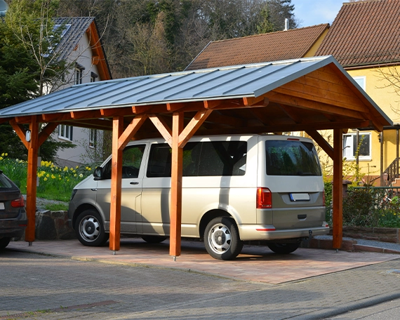 custom wooden carport New wooden Carport with Standing Seam Metal Roof in Front of a Residential Building