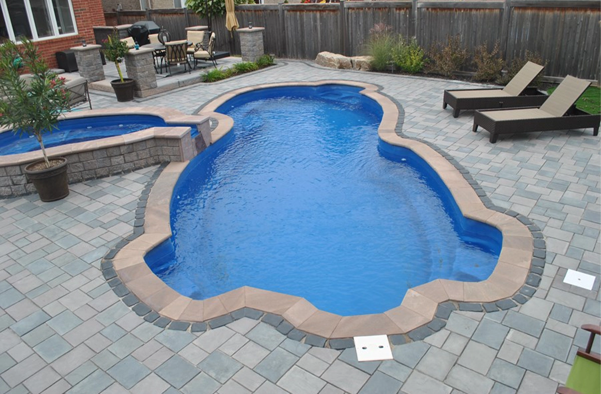 fibreglass pool durability fiberglass pool with interlocking pool coping and deck, full yard view
