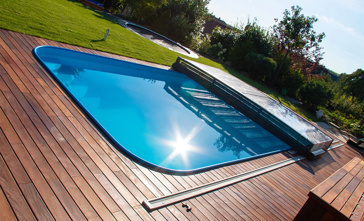 fibreglass pool with wooden deck fibreglass pool with wooden deck and pool cover in garden yard