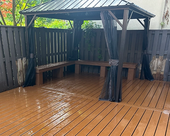 gazebo on wooden deck and fence