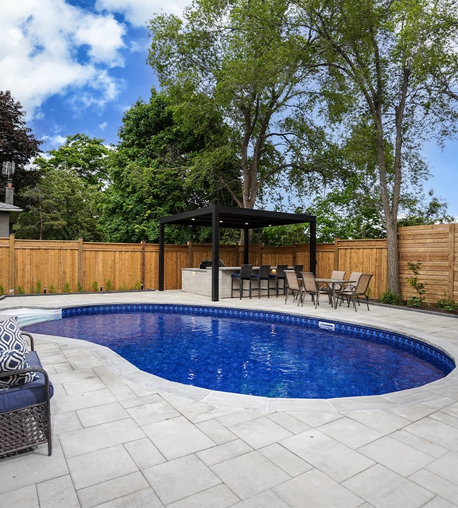 high-quality pool deck interlocking pool deck surface around swimming pool and open kitchen in backyard