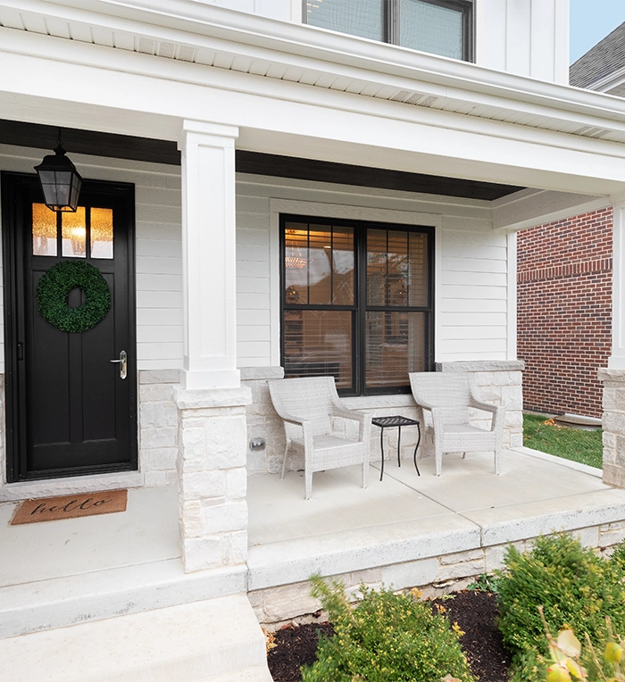 simple small home front porch, two chairs placed