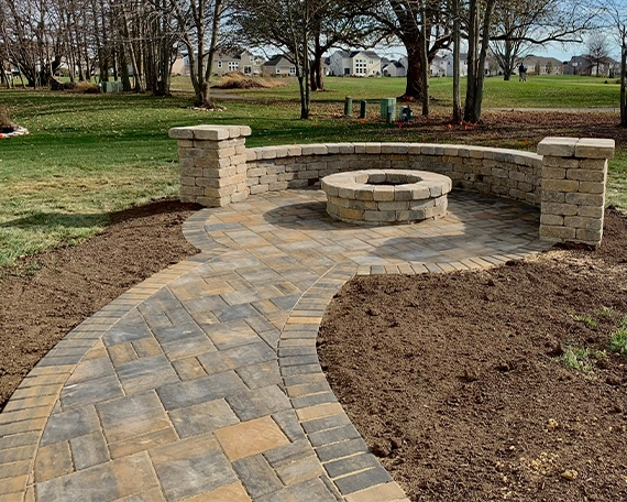 custom interlock patio with firepit and walkway
