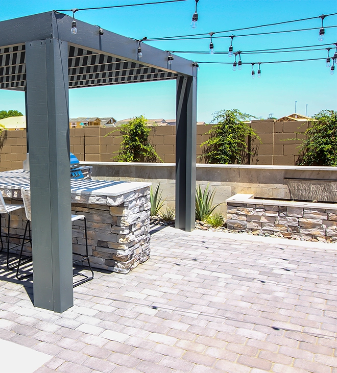 interlock patio with waterfall feature and cabana