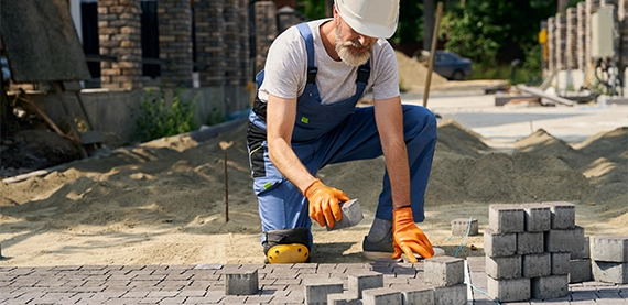 interlock repair image four professional man installing interlock blocks