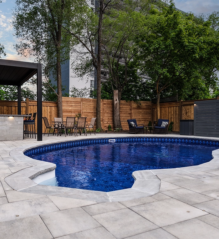 swimming pool with interlocking pool coping and deck