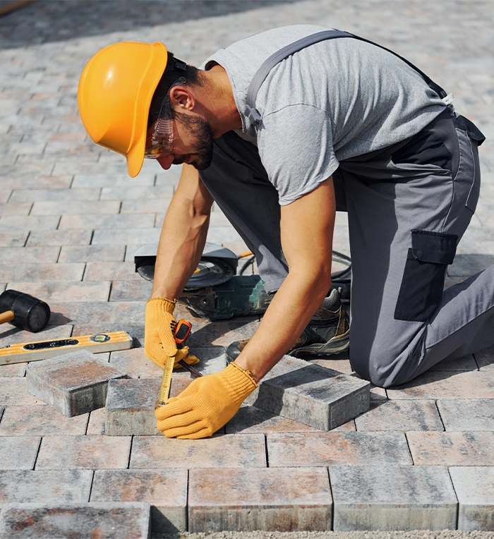 professional man repairing interlock surface