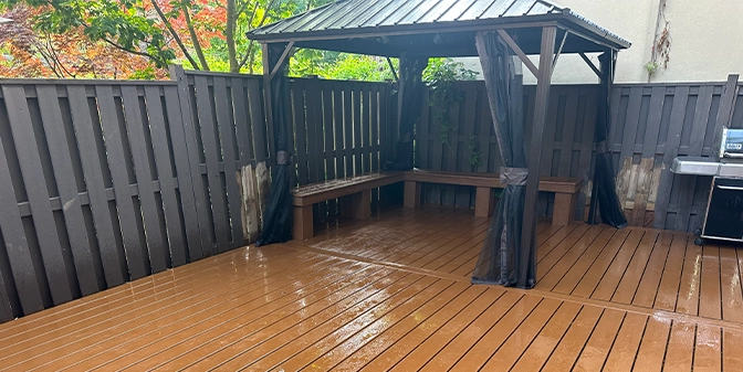 new fence and deck with custom cabana in home backyard
