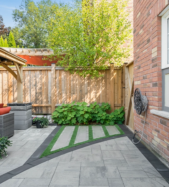 interlock patio with landscape in outdoor backyard