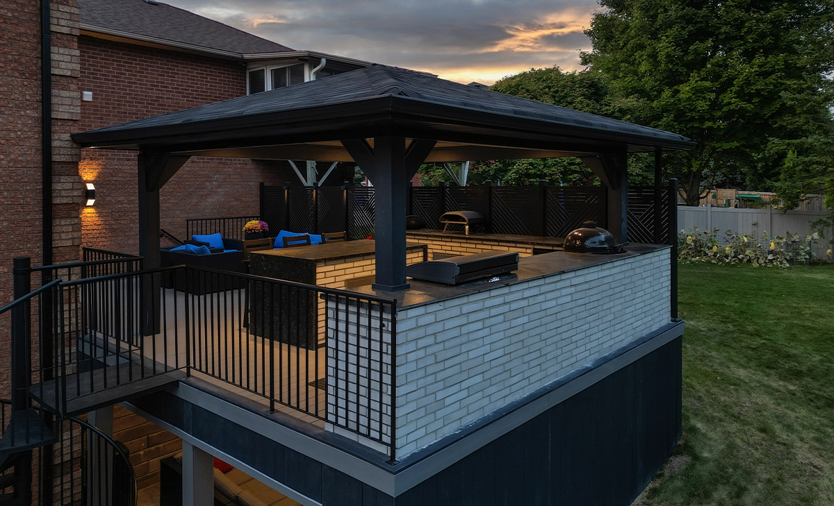 open kitchen covered under cabana in backyard