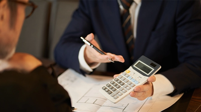 man calculating the expenses and penalties about project