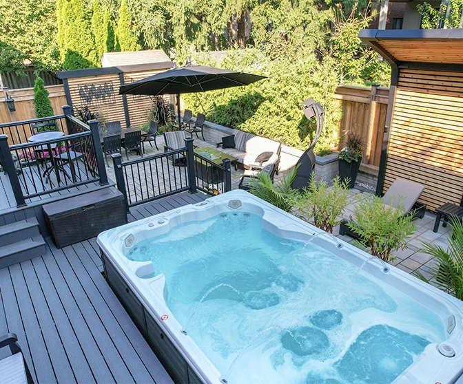 plunge pool with deck and railing in backyard. home full backyard view