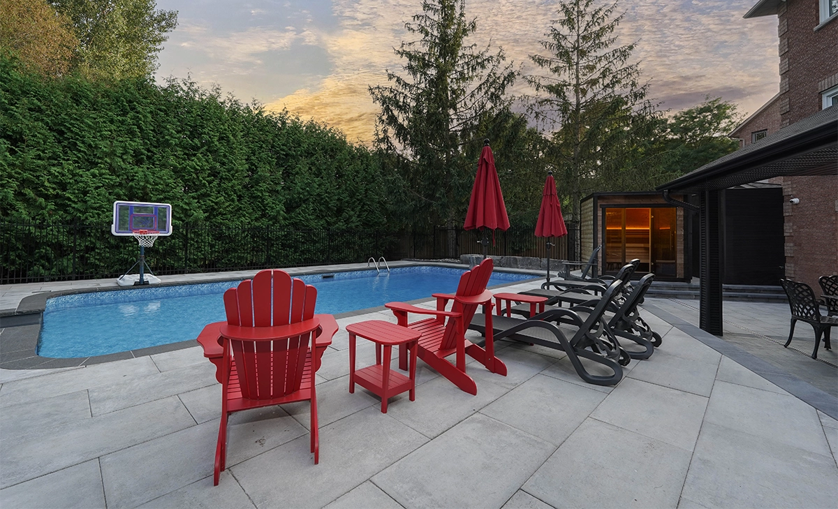 pool deck durability modern backyard. a pool with interlocking deck, sitting setup and outdoor sauna