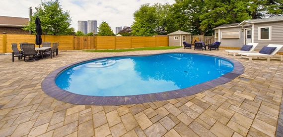 interlocking patio and surface around pool with sodding, fence and carpentry