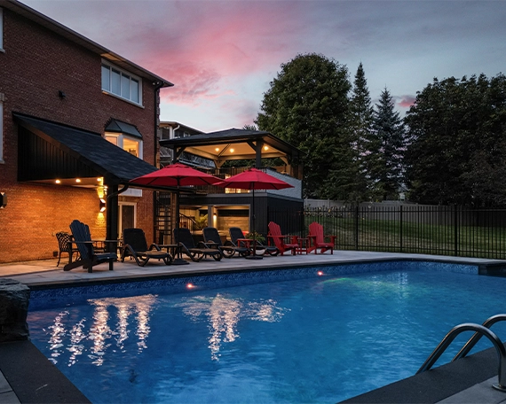 interlocking patio and surface around pool with aluminium fence and custom carpentry